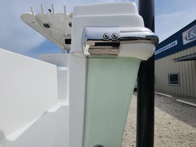 Slide: The Image of 2025 Parker 2600 CC boat detail with chrome fittings and white exterior. - 20