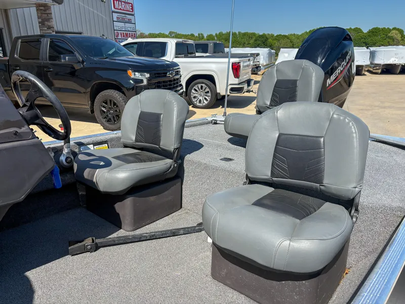 Slide: The Image of 2020 Bass Tracker Classic boat interior with gray seats and steering wheel. - 3
