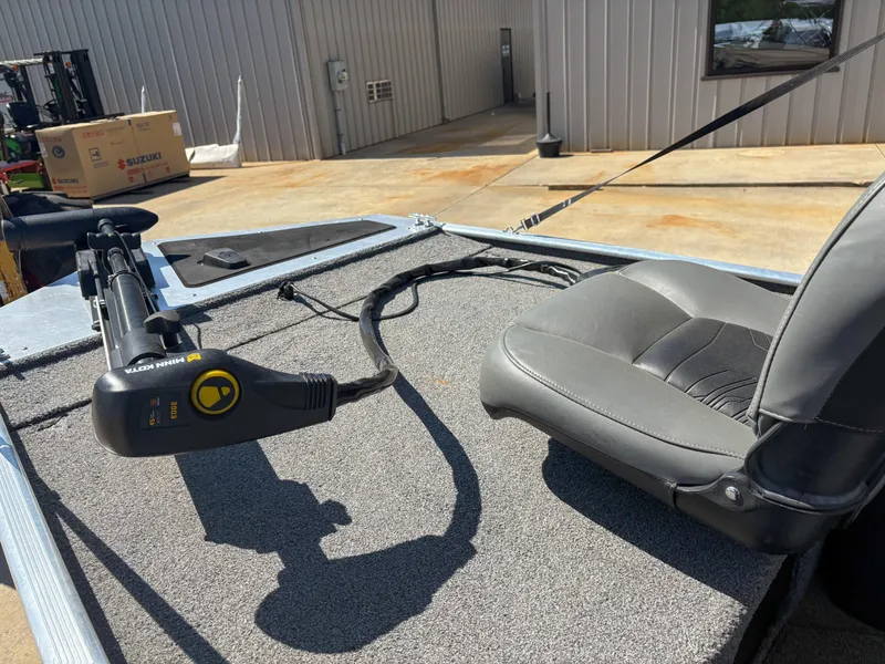 Slide: The Image of 2020 Bass Tracker Classic boat with gray seating and trolling motor on deck. - 4