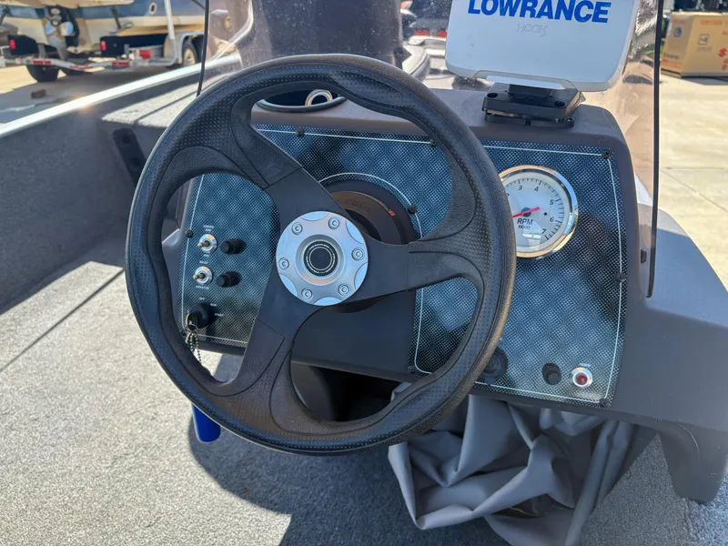 Slide: The Image of Steering wheel and dashboard of a 2020 Bass Tracker Classic boat. - 7