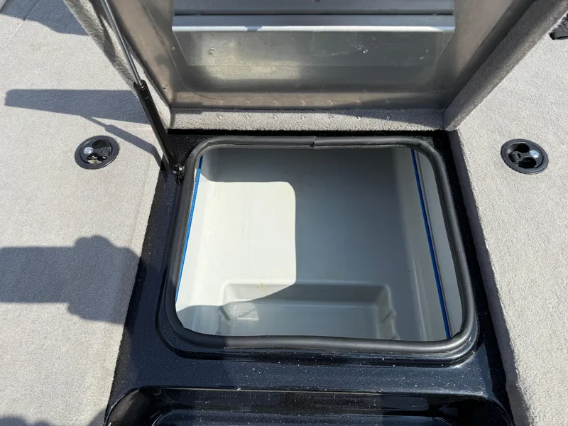 Slide: The Image of Open storage compartment on 2009 Triton 18 Explorer boat. - 14
