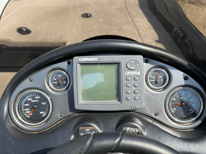 Slide: The Image of Dashboard of 2009 Triton 18 Explorer boat with Lowrance X135 fishfinder. - 24