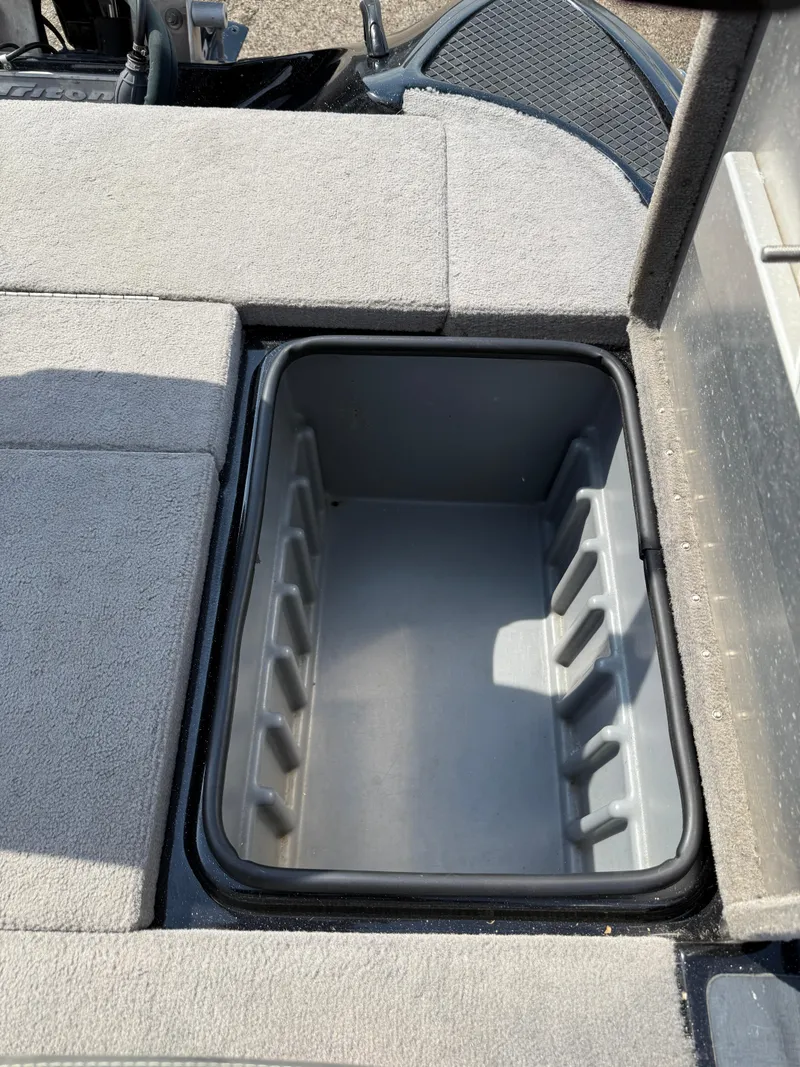 Slide: The Image of Storage compartment in 2009 Triton 18 Explorer boat, open and empty. - 28