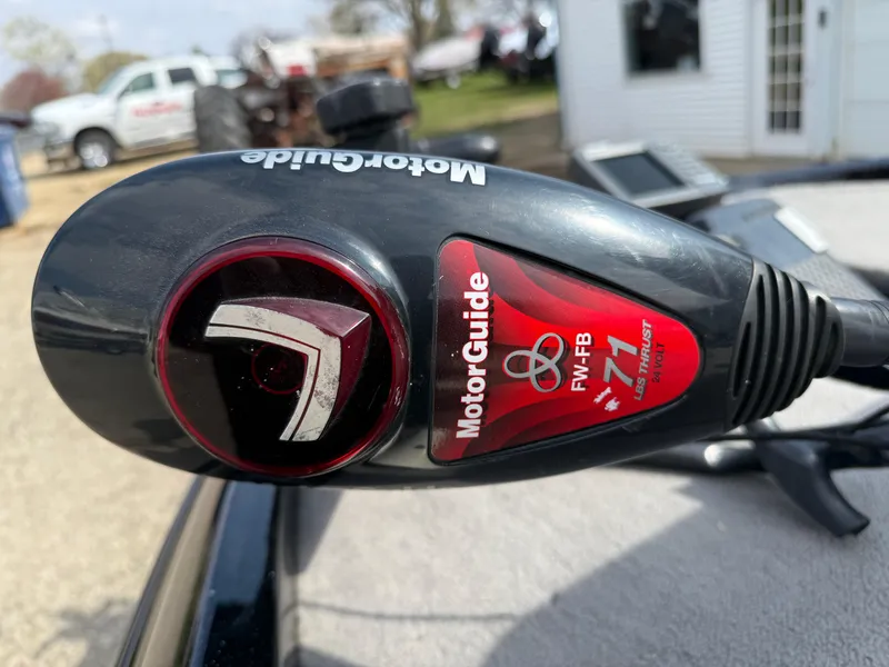 Slide: The Image of Triton 18 Explorer 2009 with MotorGuide trolling motor, FW-FB 71 model, outdoor setting. - 31