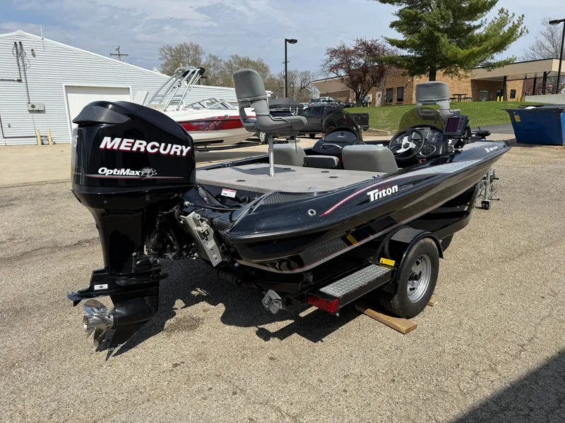 Slide: The Image of 2009 Triton 18 Explorer boat with Mercury OptiMax engine on trailer. - 5