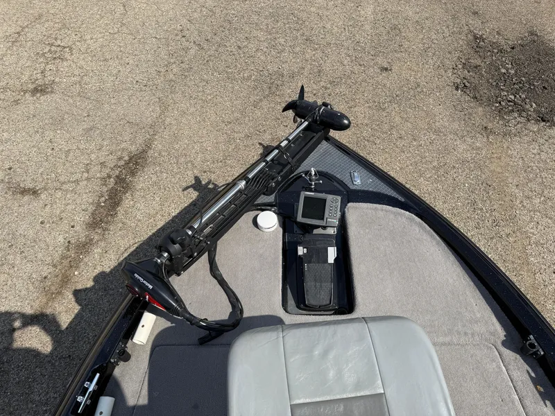 Slide: The Image of 2009 Triton 18 Explorer boat interior with trolling motor and navigation equipment. - 9