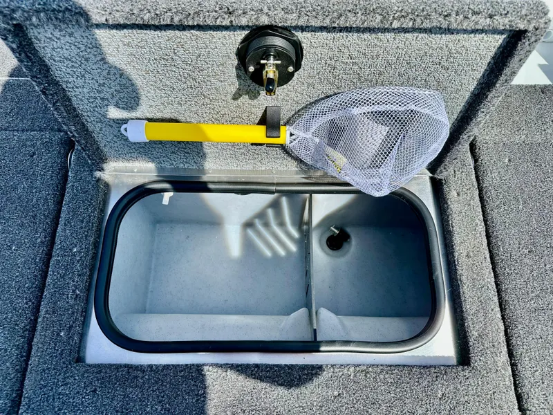 Slide: The Image of 2025 Lund 1775 Adventure Sport boat livewell with net and yellow handle. - 14