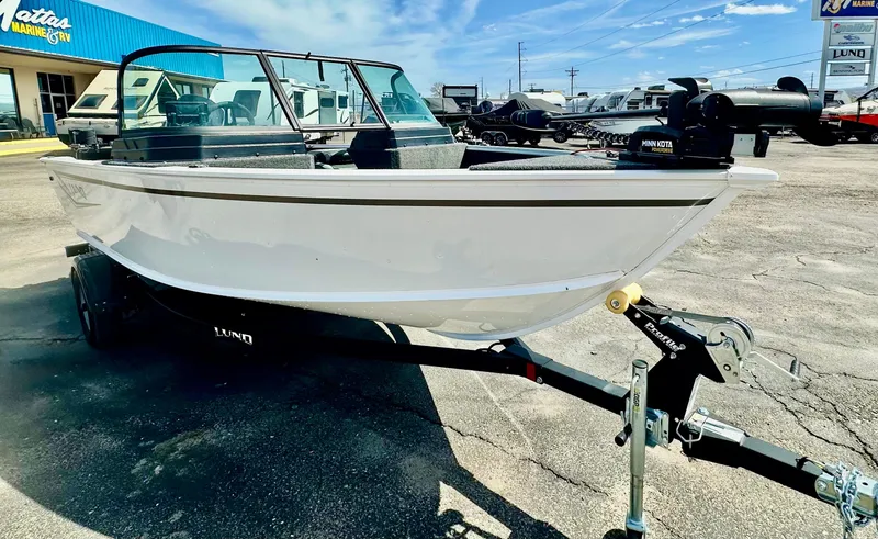 Slide: The Image of 2025 Lund 1775 Adventure Sport boat on trailer in dealership lot. - 5