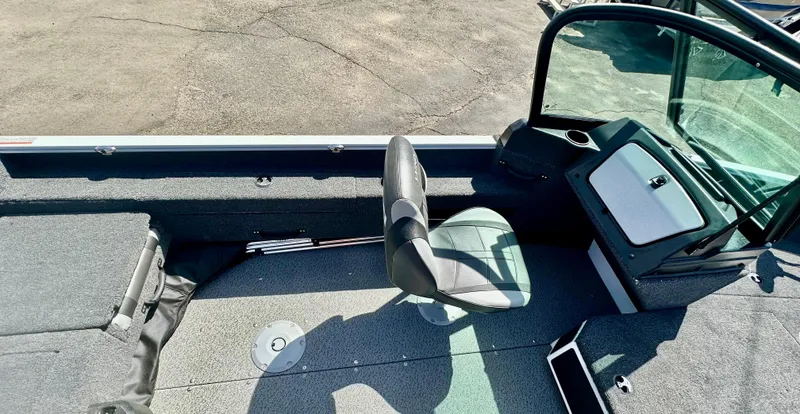 Slide: The Image of 2025 Lund 1775 Adventure Sport boat interior with seating and console. - 8