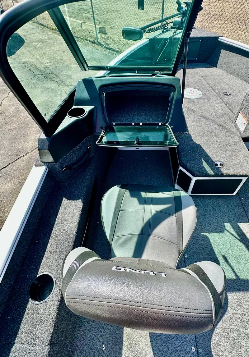 Slide: The Image of 2025 Lund 1775 Adventure Sport boat interior with seating and storage compartments. - 9