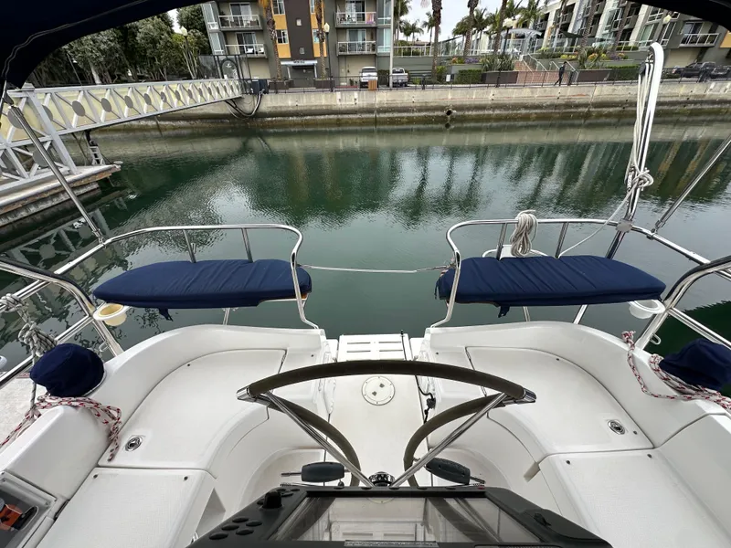 Slide: The Image of 2007 Hunter 44 Deck Salon yacht with spacious cockpit and waterfront view. - 23