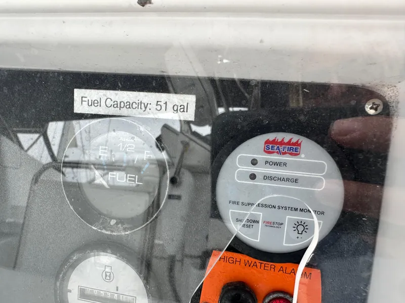 Slide: The Image of Control panel of 2007 Hunter 44 Deck Salon, showing fuel gauge and fire suppression system. - 31