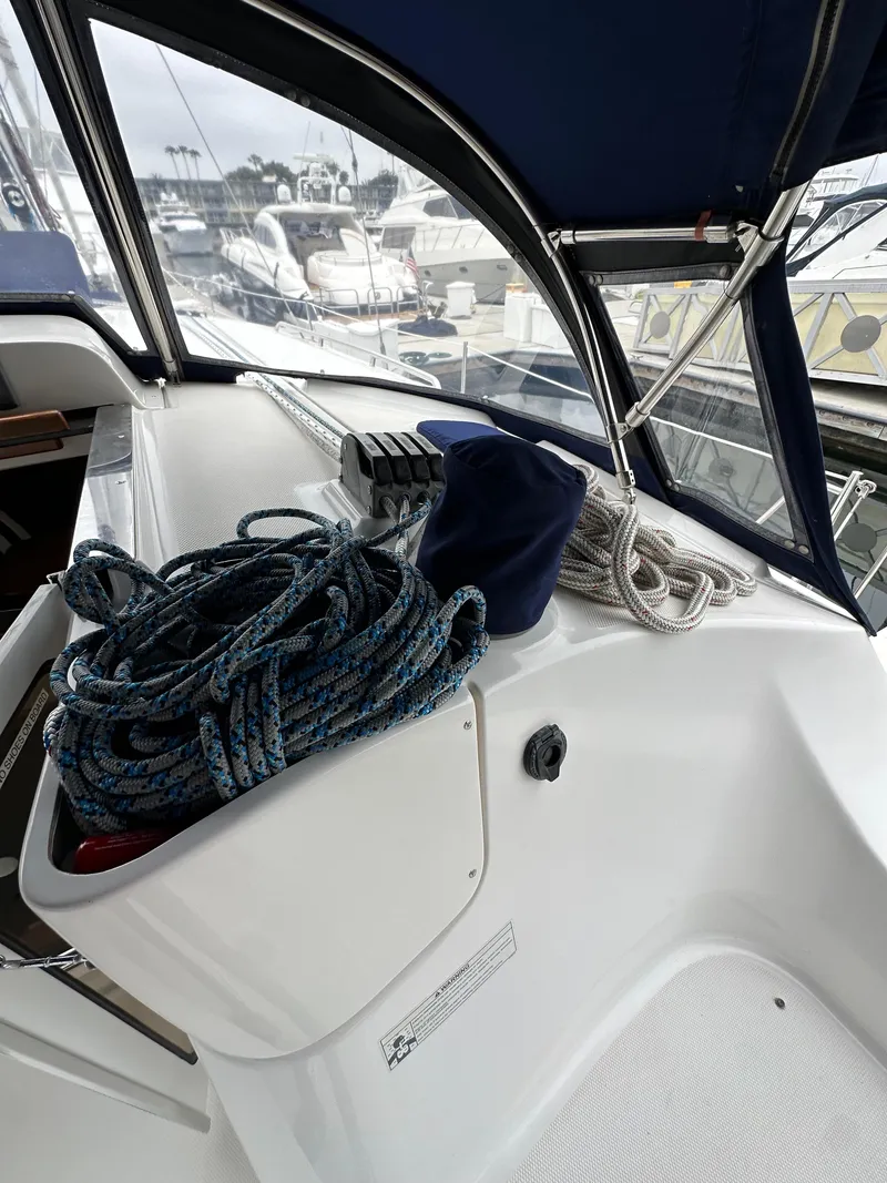 Slide: The Image of 2007 Hunter 44 Deck Salon cockpit with ropes and marina view. - 35