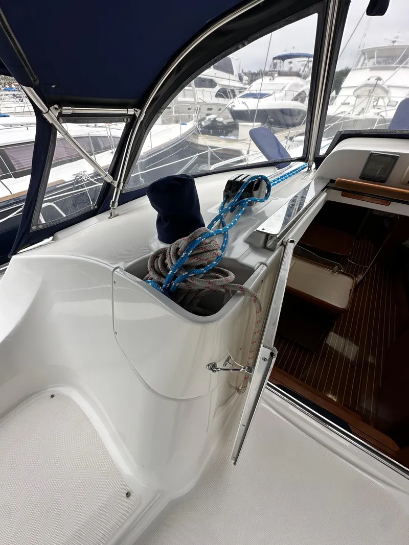 Slide: The Image of 2007 Hunter 44 Deck Salon yacht interior with ropes and seating area. - 36