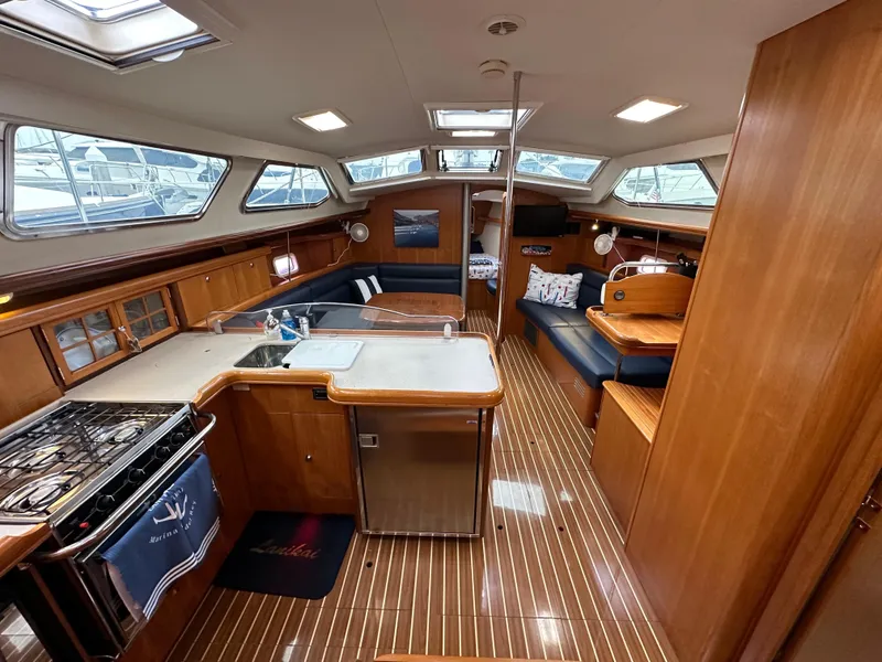 Slide: The Image of Interior of 2007 Hunter 44 Deck Salon yacht with spacious kitchen and seating area. - 39