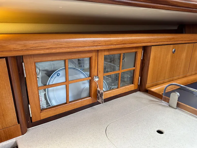 Slide: The Image of Wooden cabinet with glass doors in 2007 Hunter 44 Deck Salon yacht kitchen. - 46