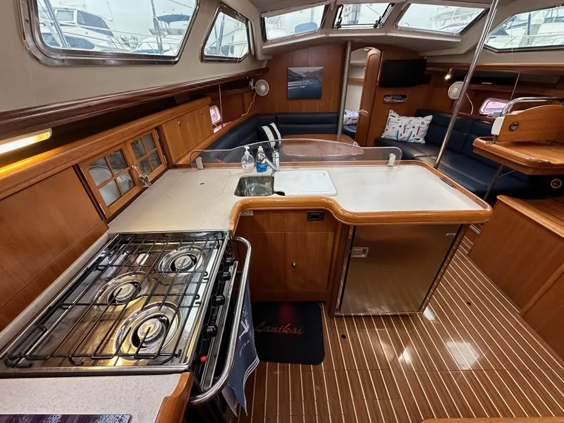 Slide: The Image of Interior of 2007 Hunter 44 Deck Salon yacht with kitchen and seating area. - 47