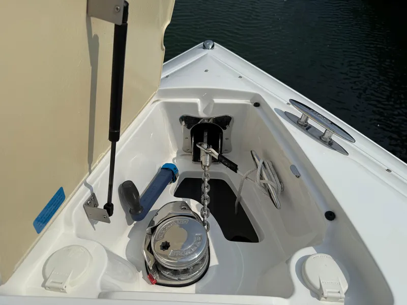 Slide: The Image of Anchor compartment of a 2015 Cobalt 302 boat with chain and rope. - 20