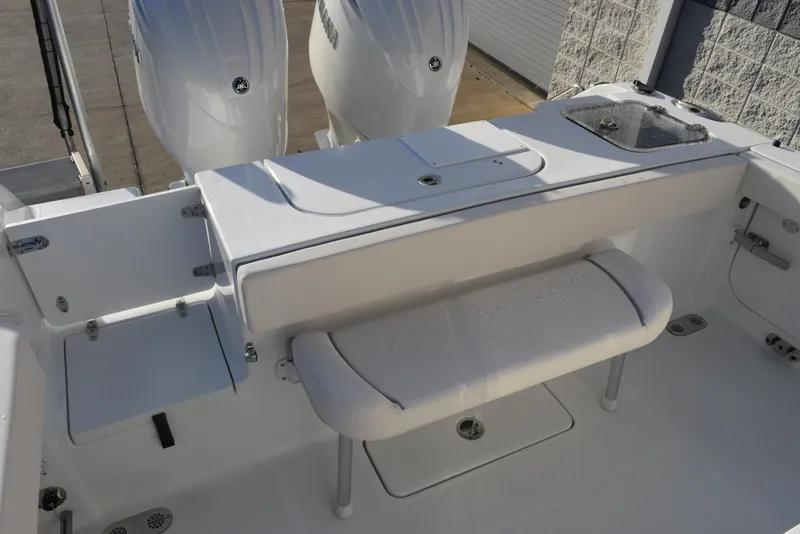 Slide: The Image of 2025 Sea Hunt Gamefish 25 boat interior with dual engines and seating area. - 10