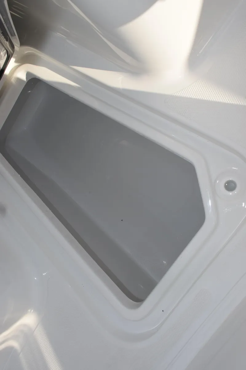 Slide: The Image of 2025 Sea Hunt Gamefish 25 boat interior compartment, featuring sleek design and ample storage. - 13