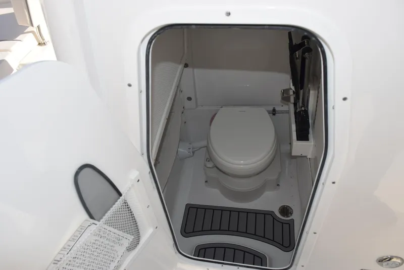 Slide: The Image of Interior view of 2025 Sea Hunt Gamefish 25 boat bathroom with toilet. - 14