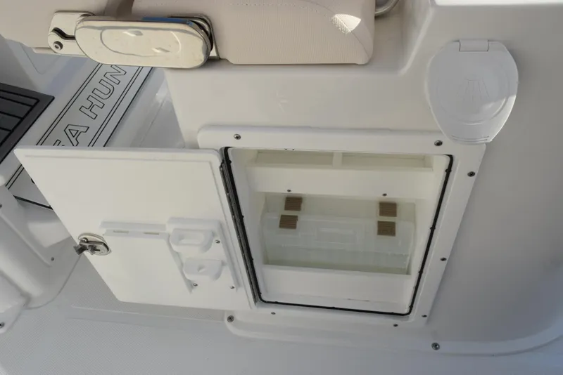 Slide: The Image of 2025 Sea Hunt Gamefish 25 boat storage compartment with open hatch. - 15
