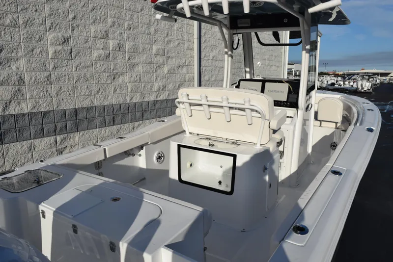 Slide: The Image of 2025 Sea Hunt Gamefish 25 boat, white interior, spacious deck, modern design, outdoor setting. - 6