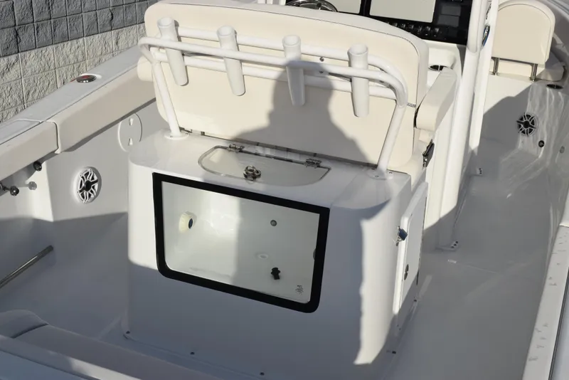 Slide: The Image of 2025 Sea Hunt Gamefish 25 boat interior with rod holders and storage compartment. - 7