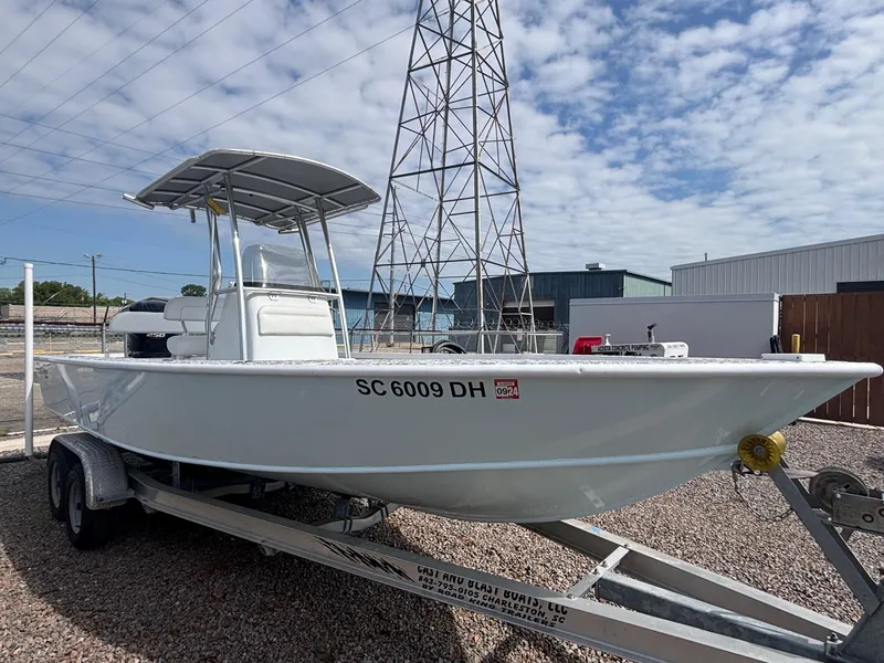 Slide: The Image of 2018 Cast & Blast 22 Kings Bay boat on trailer, parked outdoors under cloudy sky. - 4