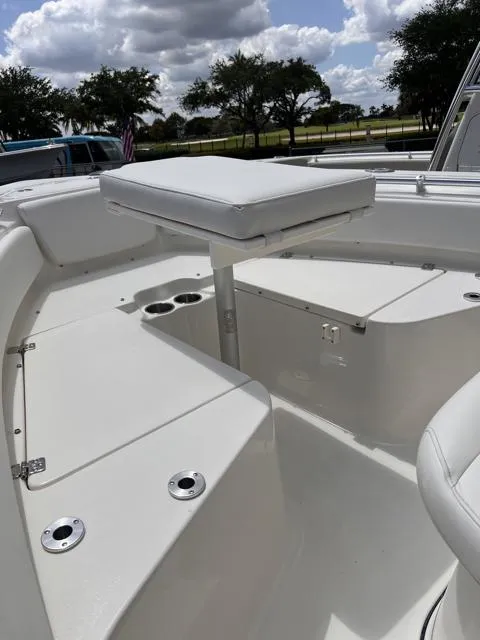 Slide: The Image of 2025 Key West 219 FS boat interior with seating and storage compartments. - 22