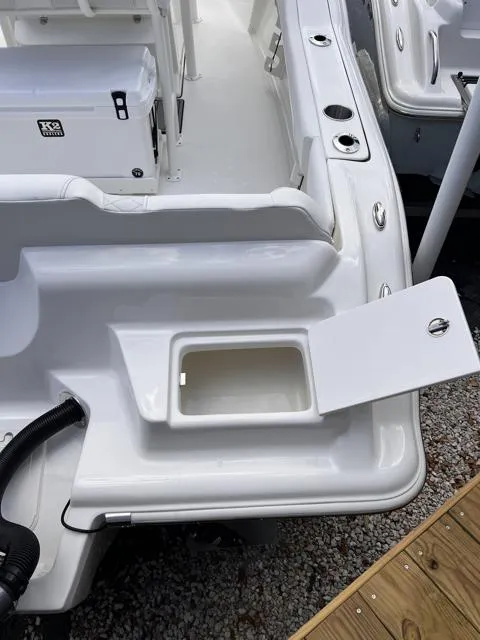 Slide: The Image of 2025 Key West 219 FS boat with open storage compartment on deck. - 30