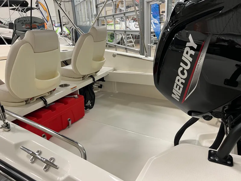 Slide: The Image of 2025 Boston Whaler 160 Super Sport interior with Mercury engine and seating. - 3