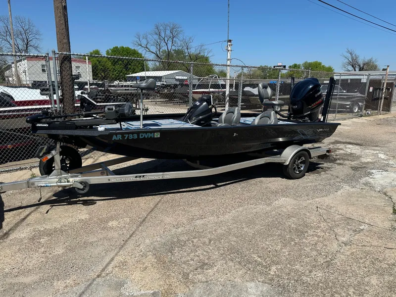 Slide: The Image of 2021 Xpress X19 Pro boat on trailer in outdoor lot. - 0