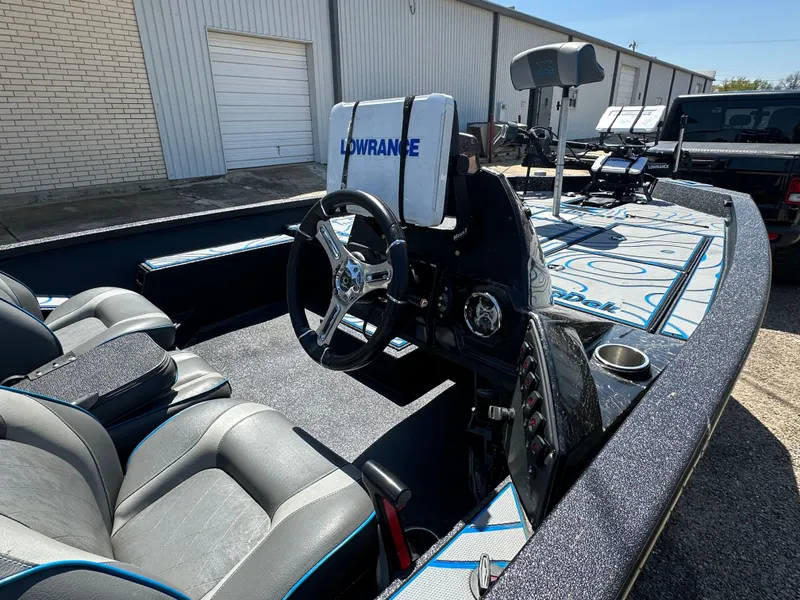 Slide: The Image of Interior of 2021 Xpress X19 Pro boat with steering wheel and navigation equipment. - 7