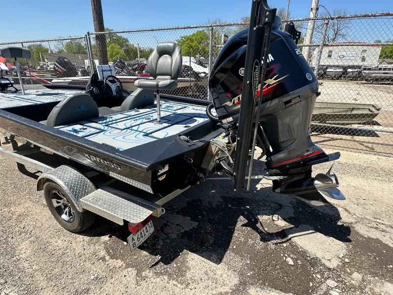 Slide: The Image of Xpress X19 Pro 2021 boat with Yamaha outboard motor on a trailer. - 8