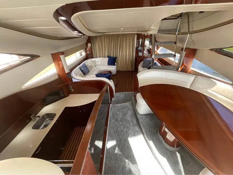 Slide: The Image of Luxurious interior of a 2003 Viking Princess 65 yacht with elegant wood finishes. - 13