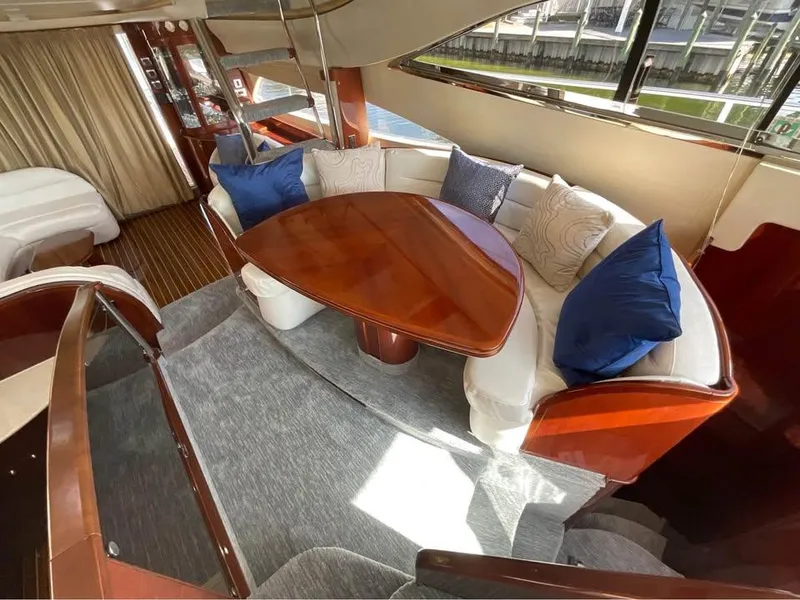 Slide: The Image of Luxurious interior of 2003 Viking Princess 65 yacht with elegant seating and wooden table. - 18