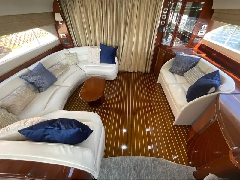 Slide: The Image of Luxurious 2003 Viking Princess 65 yacht interior with elegant seating and polished wood flooring. - 20