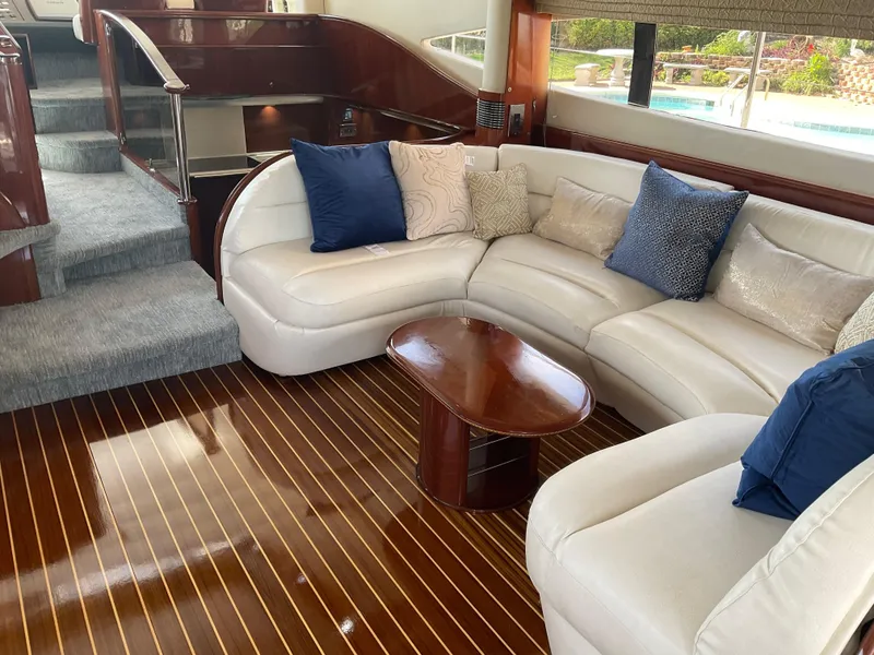 Slide: The Image of Luxurious interior of 2003 Viking Princess 65 yacht with elegant seating and wooden flooring. - 21