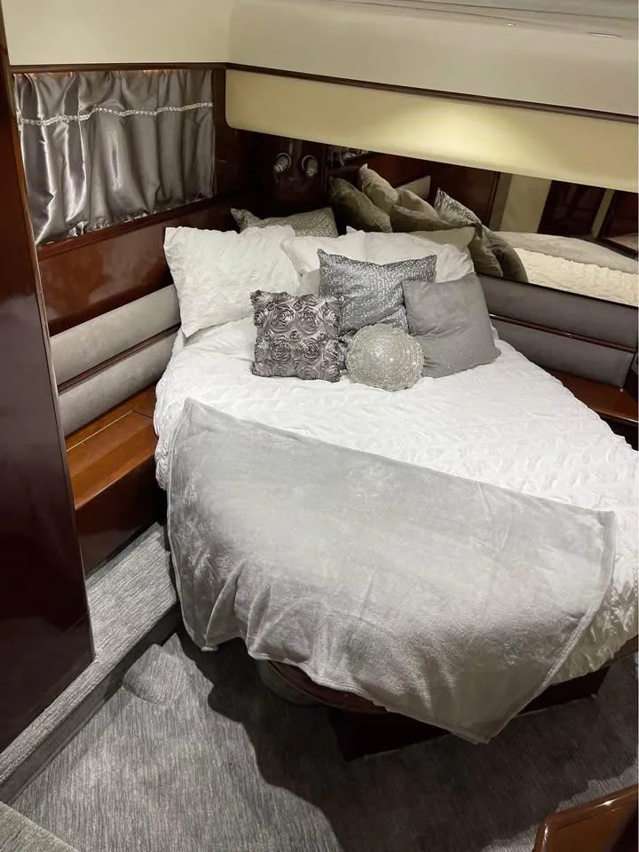 Slide: The Image of Luxurious bedroom in 2003 Viking Princess 65 yacht with elegant bedding and decor. - 23