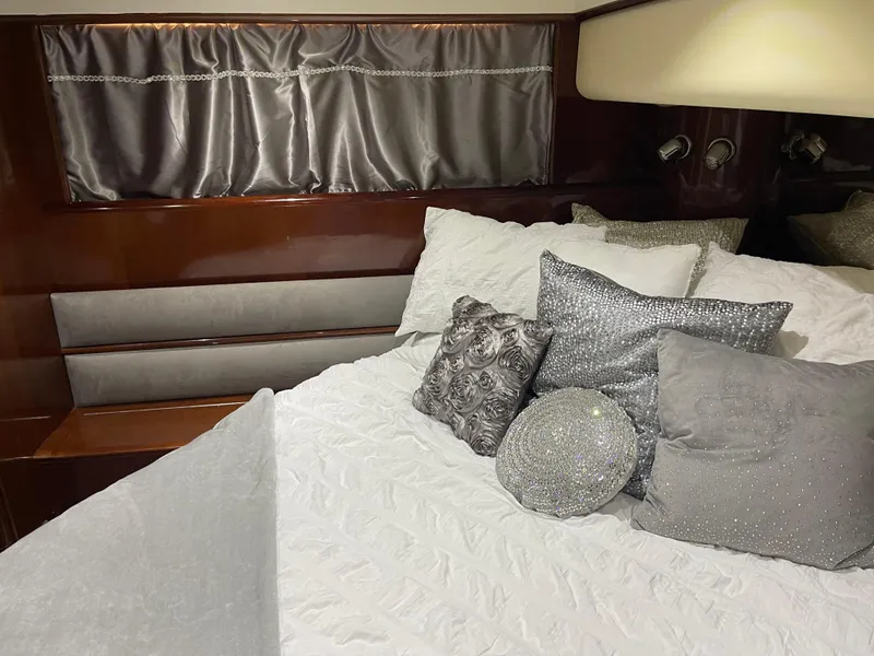 Slide: The Image of Luxurious bedroom interior of 2003 Viking Princess 65 yacht with elegant pillows and bedding. - 25
