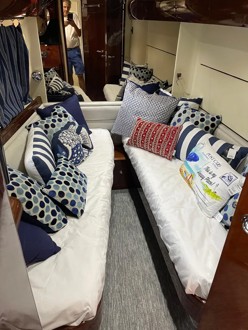 Slide: The Image of Interior of 2003 Viking Princess 65 yacht with cozy twin beds and decorative pillows. - 26
