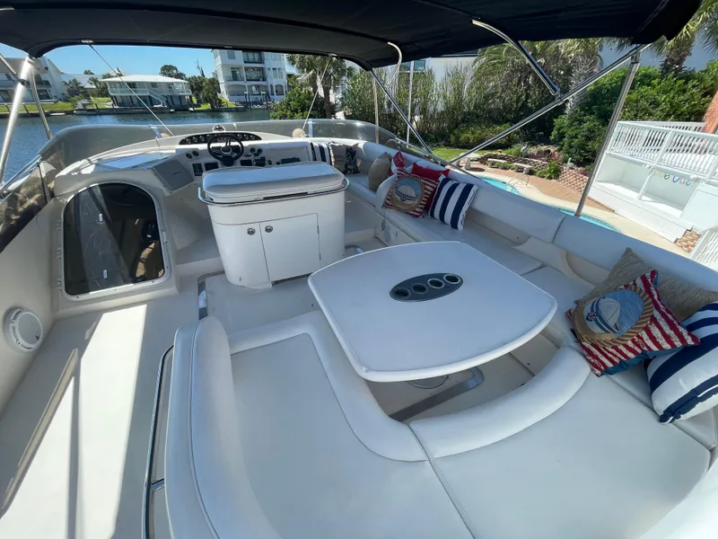 Slide: The Image of Luxurious 2003 Viking Princess 65 yacht with spacious outdoor seating and elegant design. - 6