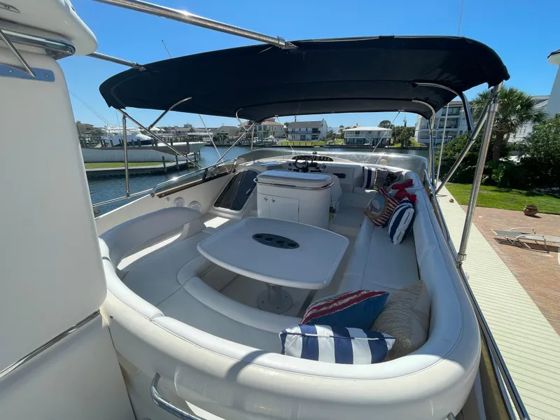 Slide: The Image of Luxurious 2003 Viking Princess 65 yacht with spacious deck and seating area. - 8