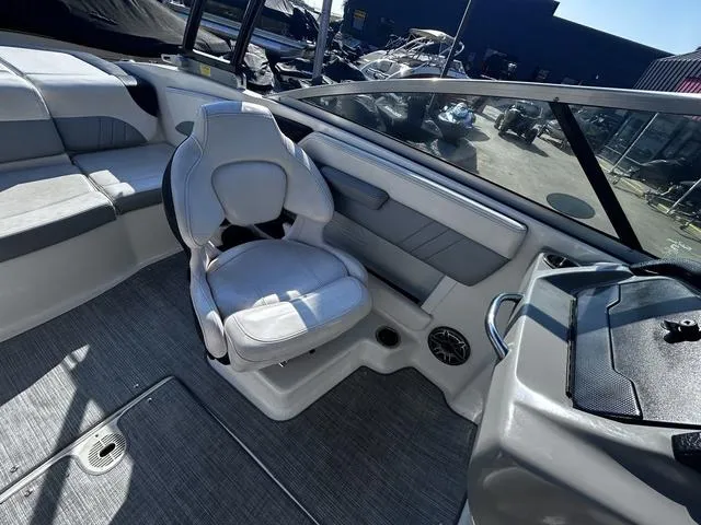 Slide: The Image of 2020 Chaparral 21 Surf boat interior with seating and dashboard. - 11