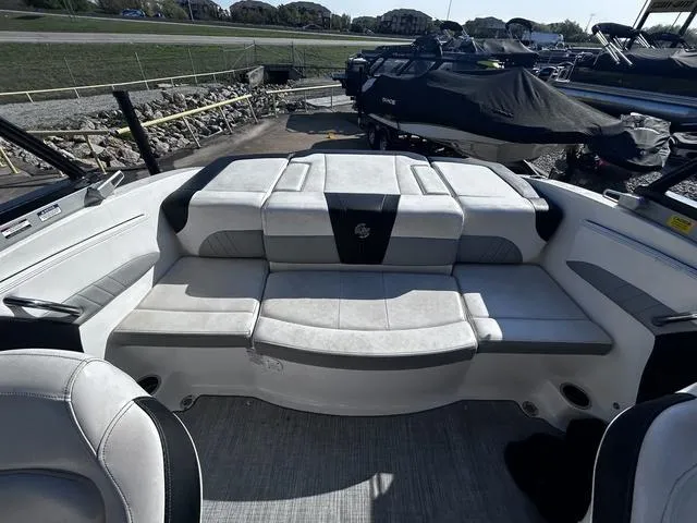 Slide: The Image of 2020 Chaparral 21 Surf boat interior with spacious seating and modern design. - 12