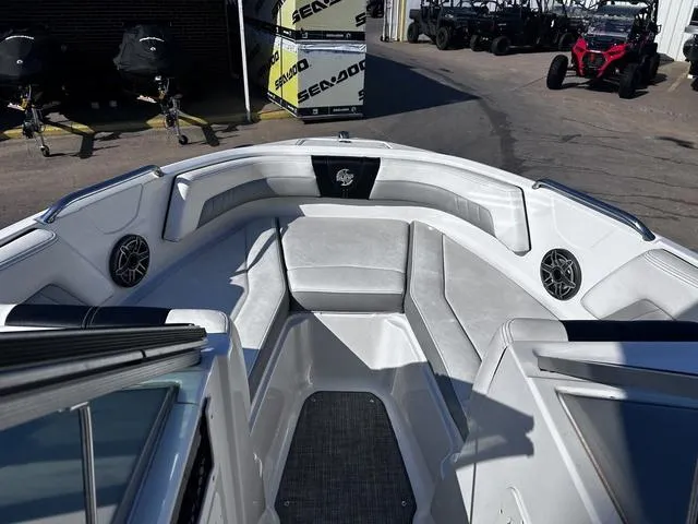 Slide: The Image of 2020 Chaparral 21 Surf boat interior with gray seating and speakers. - 7