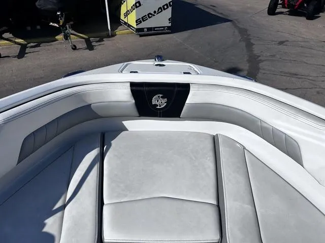 Slide: The Image of 2020 Chaparral 21 Surf boat interior with white cushioned seating. - 8