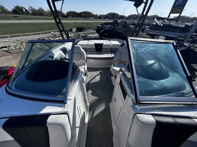 Slide: The Image of 2020 Chaparral 21 Surf boat interior with open windshield and seating area. - 9