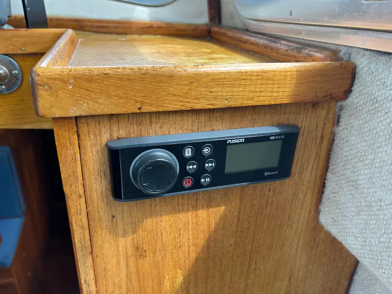 Slide: The Image of Control panel on 1975 Fisher 30 Motorsailer, mounted on wooden interior surface. - 13